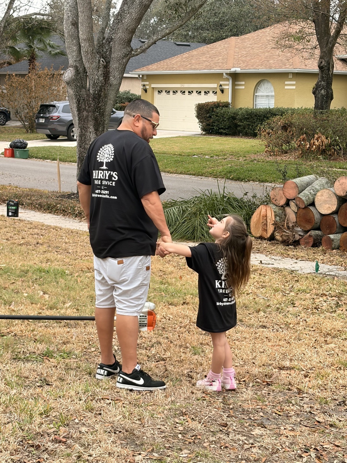Nathan, owner of Kirby's Tree Service, with his daughter