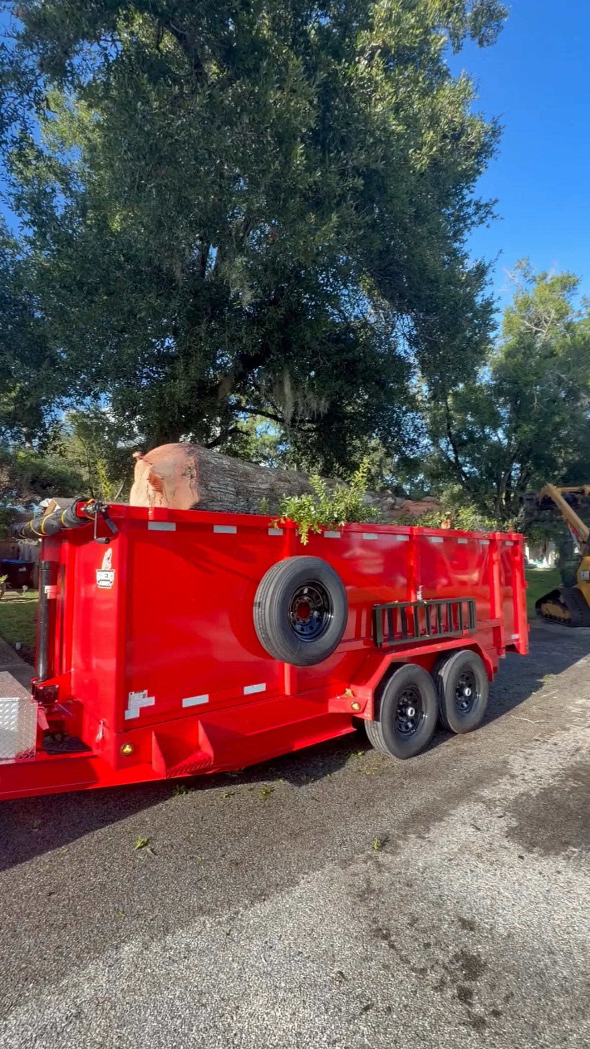 Loaded red dump trailer